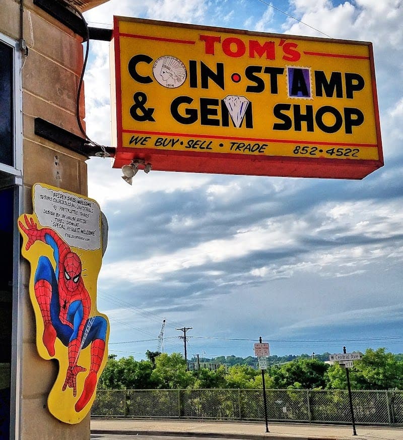 Tom's Coin Stamp Gem Baseball & Comic Shop